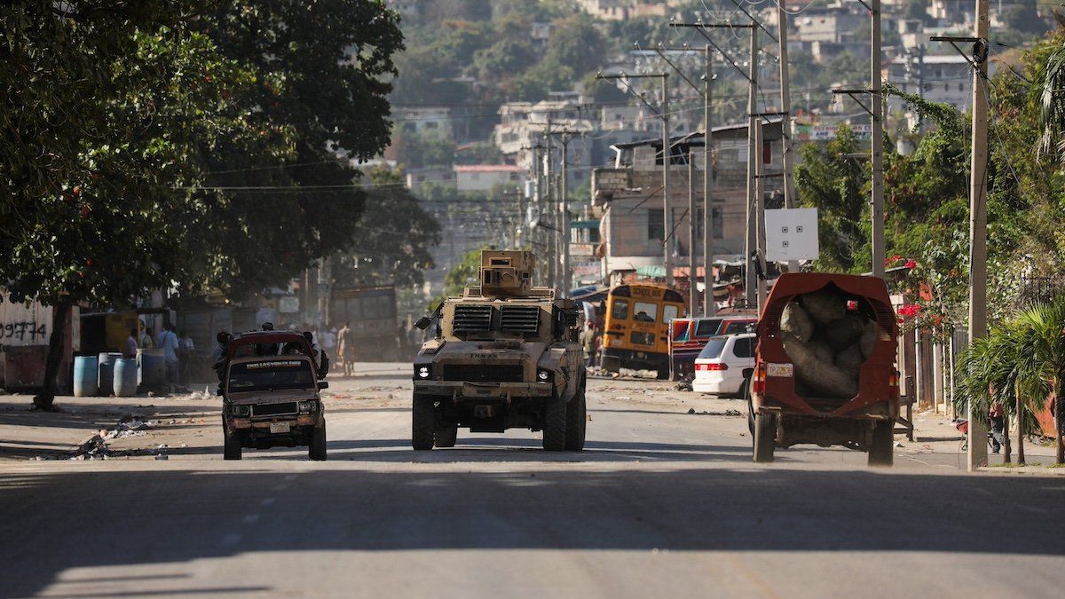 An armed vehicle is seen near the National Penitentiary following violent clashes in the capital that have damaged communications and led to a prison escape from this main penitentiary in Port-au-Prince, Haiti March 3, 2024. 