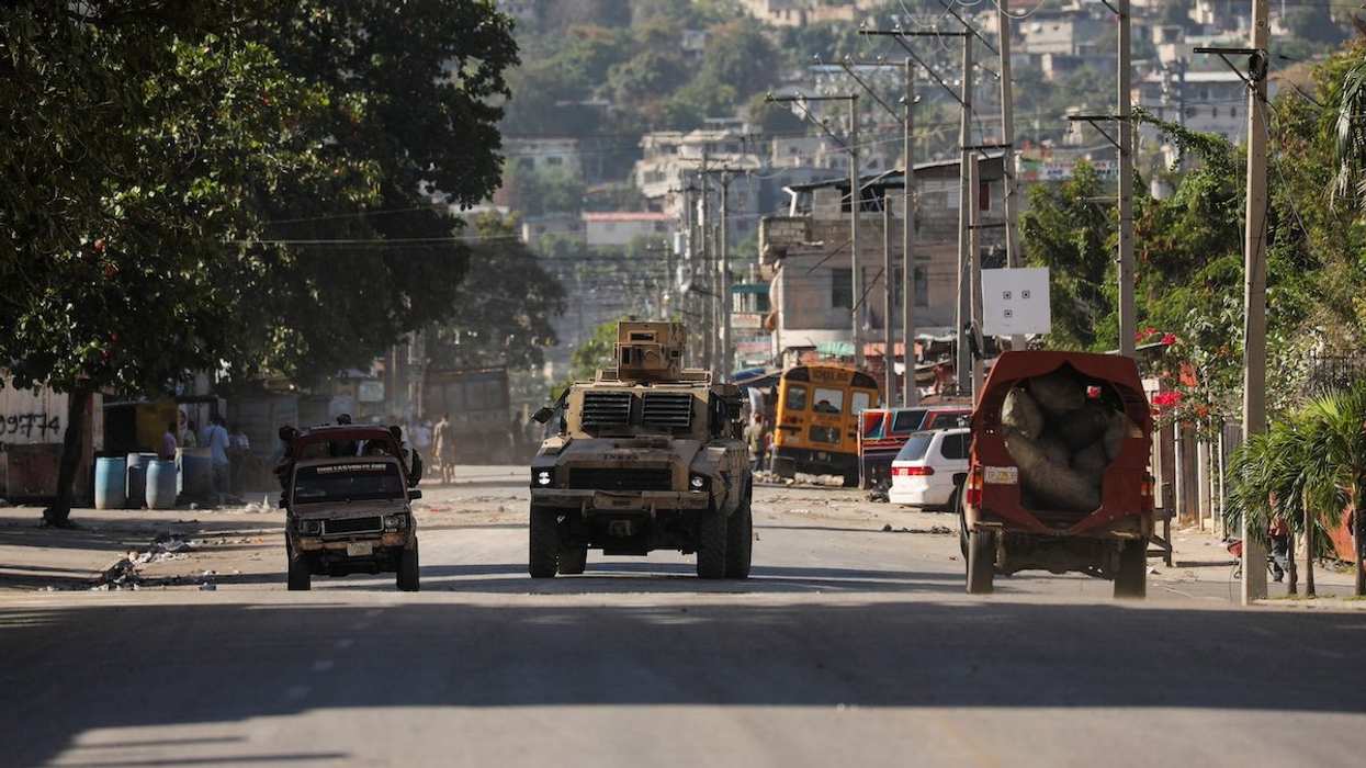 An armed vehicle is seen near the National Penitentiary following violent clashes in the capital that have damaged communications and led to a prison escape from this main penitentiary in Port-au-Prince, Haiti March 3, 2024.
