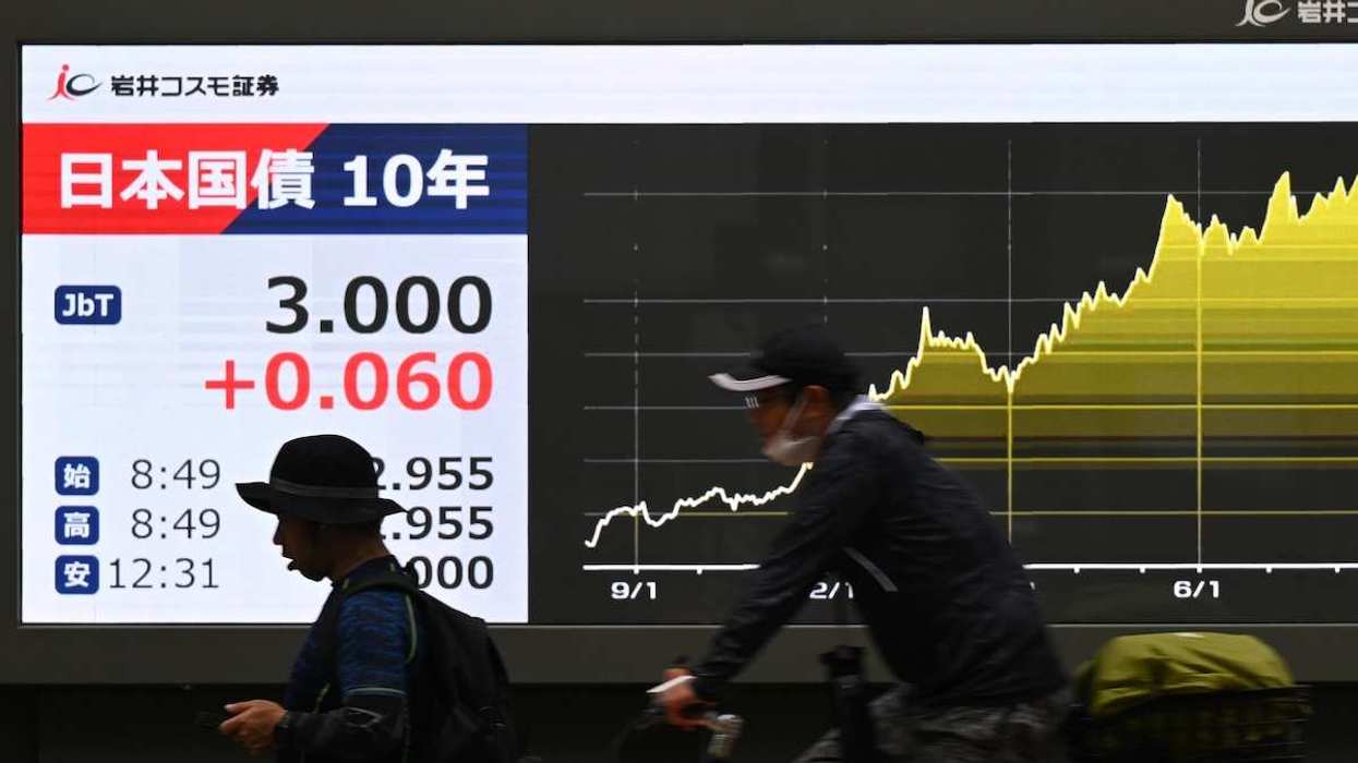 An electronic board displays that the secondary market yield on newly issued 10-year government bonds has risen to 3.000 percent, in Chuo Ward, Tokyo, Japan.