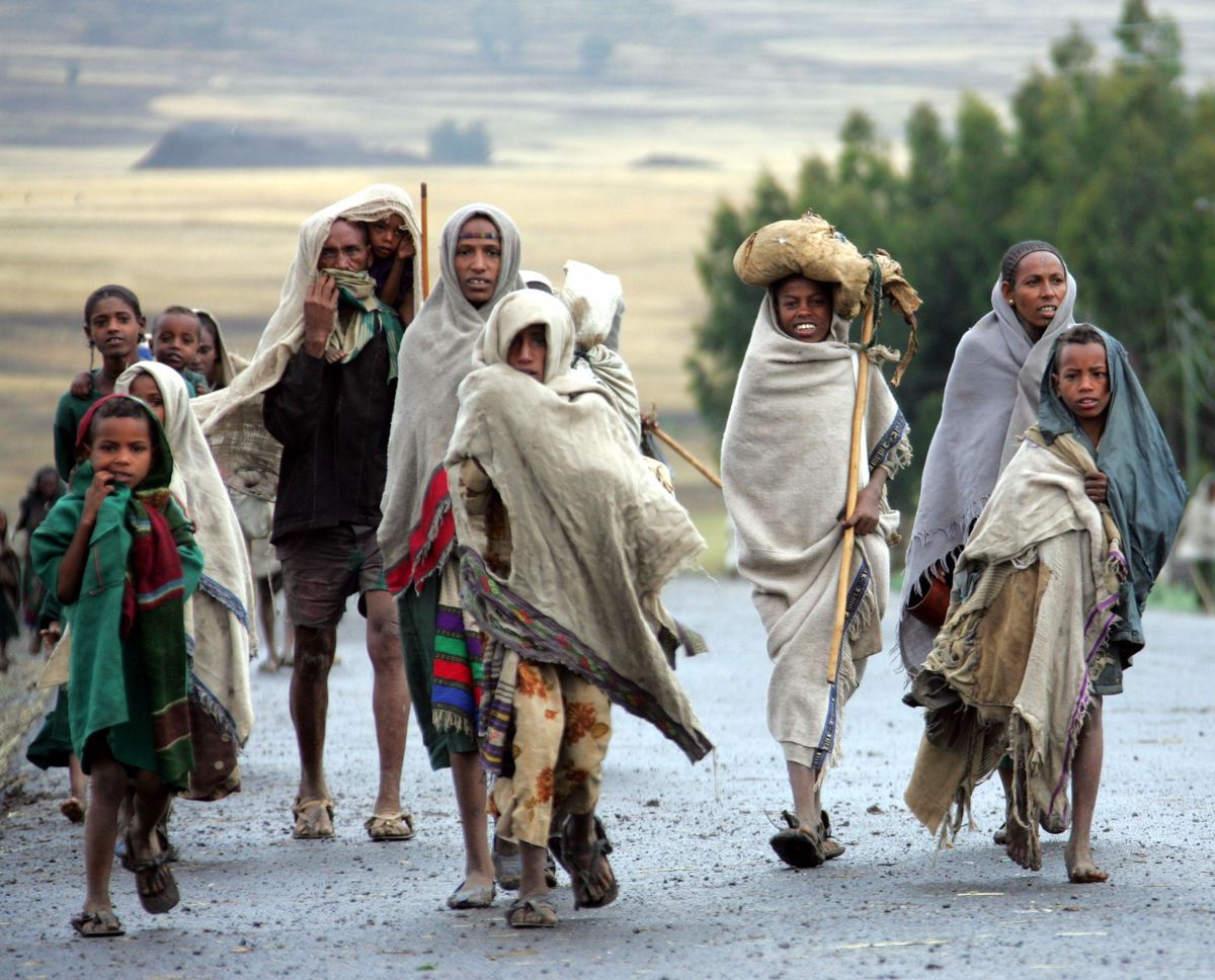 ​An Ethiopian family in search of food from fleeing remote villages where wells have dried up due to drought arrives in Korom, northeast Ethiopia.