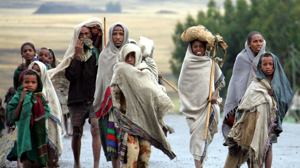 An Ethiopian family in search of food from fleeing remote villages where wells have dried up due to drought arrives in Korom, northeast Ethiopia.