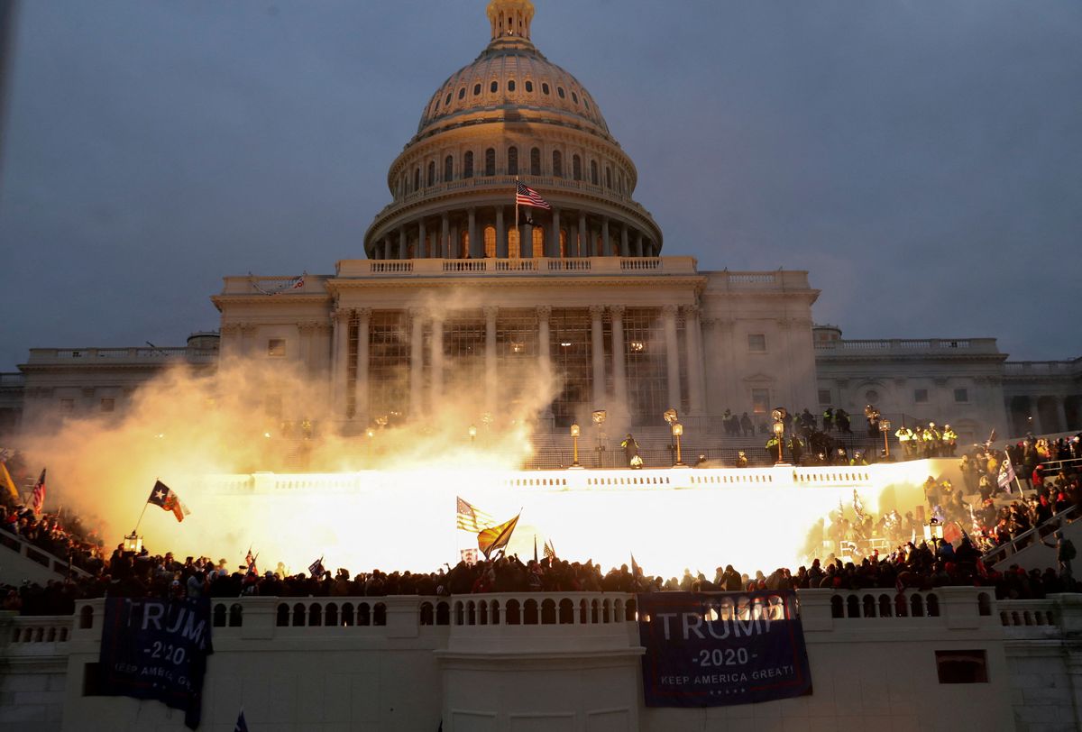 An explosion caused by a police munition while supporters of U.S. President Donald Trump storm the U.S. Capitol Building.