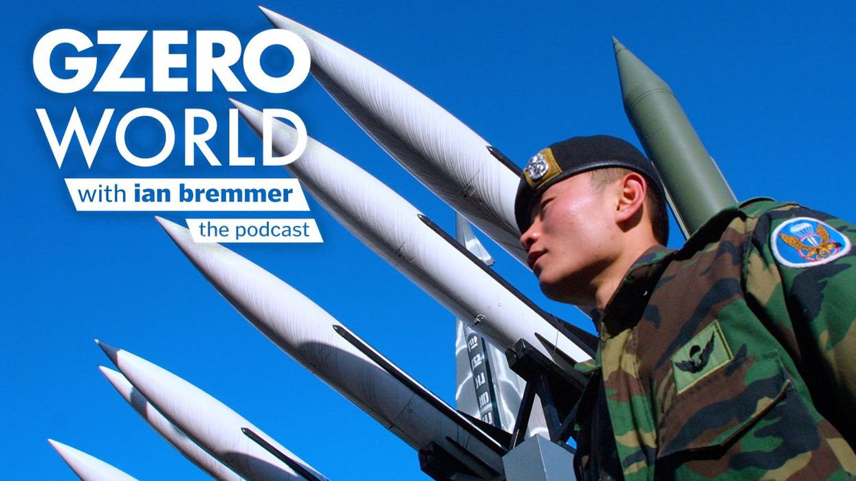 An image of a South Korean soldier standing under a display of North and South Korea's missiles with the GZERO World Podcast logo superimposed on top.