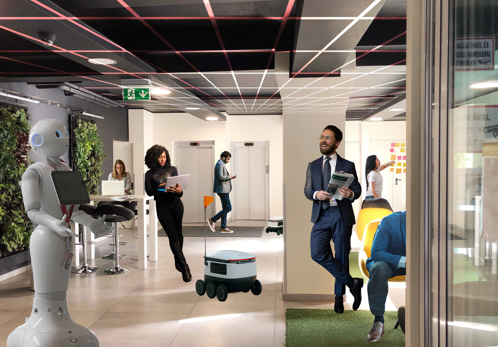 an image showing robots and human in a work space.