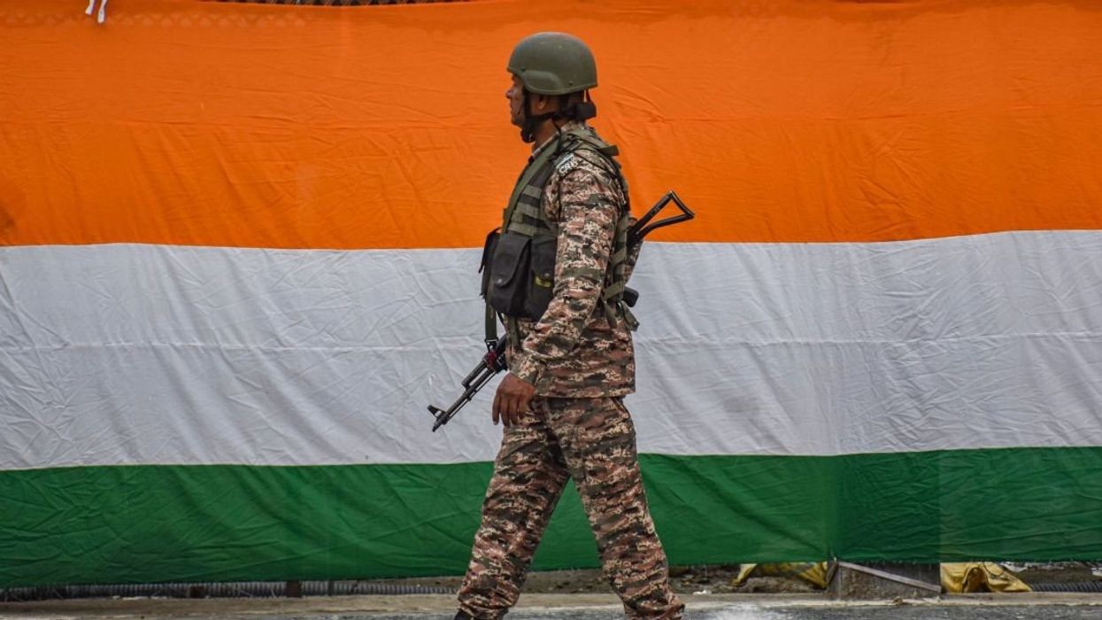 An Indian paramilitary soldier guards a road during India's 79th Independence Day celebrations in Srinagar, Jammu and Kashmir, on August 15, 2025. Prime Minister Narendra Modi issues a stern warning to Pakistan, stating that India will not tolerate nuclear blackmail anymore and will give a befitting reply to the enemy. He asserts that India has now set a ''new normal'' of not differentiating between terrorists and those who nurture terrorism.