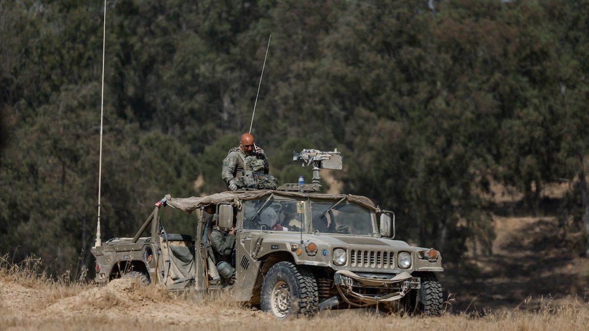 An Israeli soldier looks on from a vehicle near the Israel-Gaza border, amid the ongoing conflict between Israel and Hamas, in Israel, April 30, 2024.