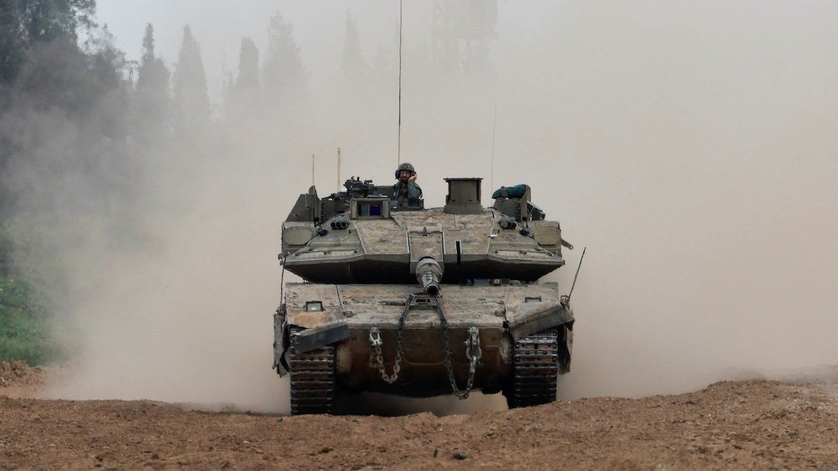 An Israeli tank maneuvers near Israel's border with Gaza, amid the ongoing conflict between Israel and the Palestinian Islamist group Hamas, in southern Israel, March 21, 2024.