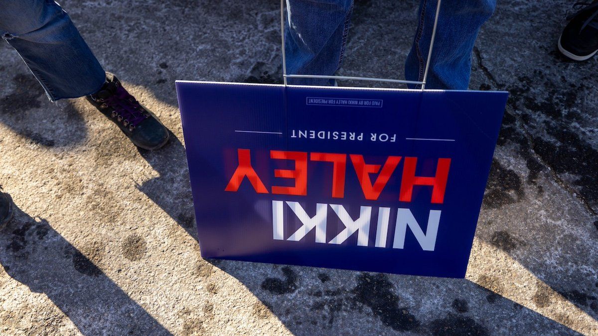 An upside-down sign rests on the frozen ground outside Republican presidential candidate, former U.N. Ambassador Nikki Haley’s campaign event at the Franklin VFW on January 22, 2024, in Franklin, New Hampshire.