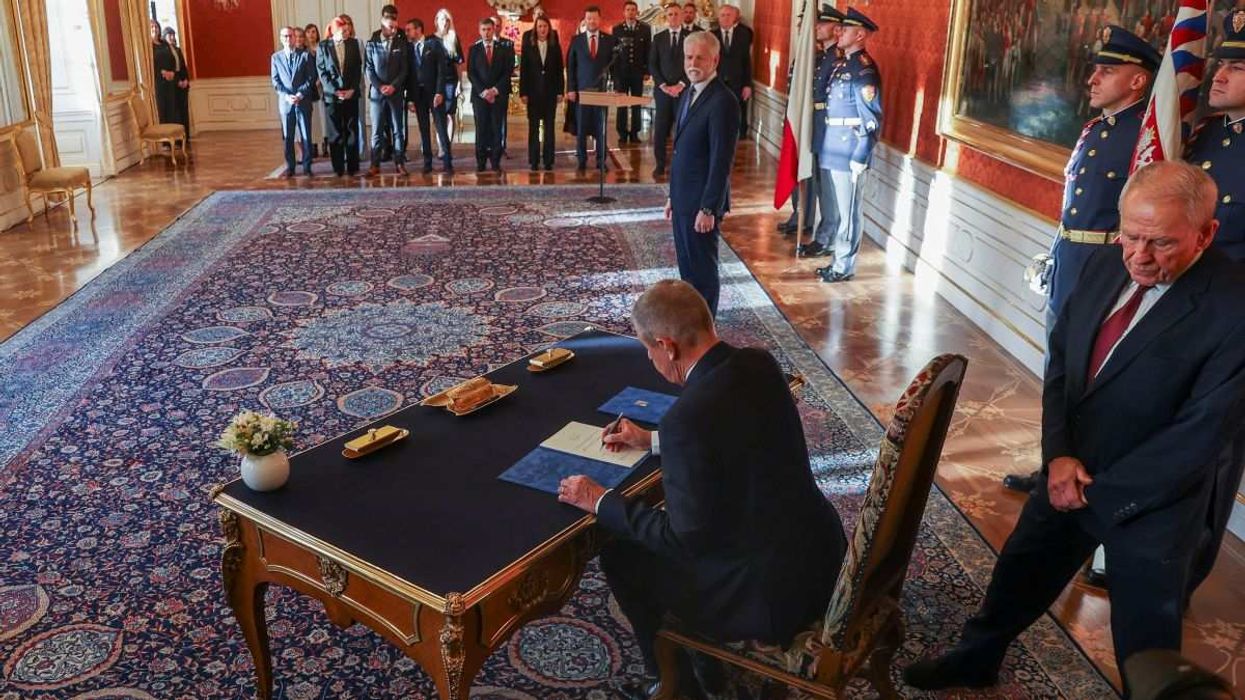 ANO party leader Andrej Babis signs a document on the day he is appointed as the country's new prime minister in Prague, Czech Republic, on December 9, 2025.