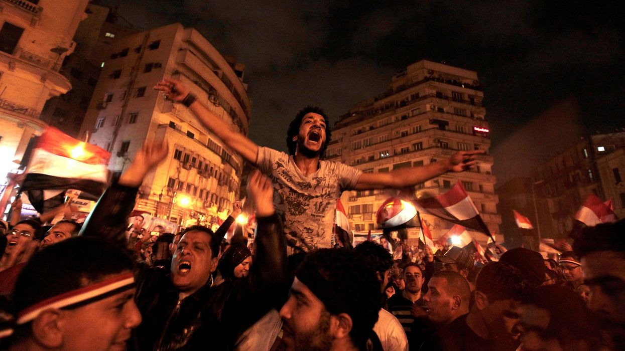Anti-government protesters celebrate inside Tahrir Square after the announcement of Egyptian President Hosni Mubarak's resignation in Cairo, Egypt, February 11, 2011.