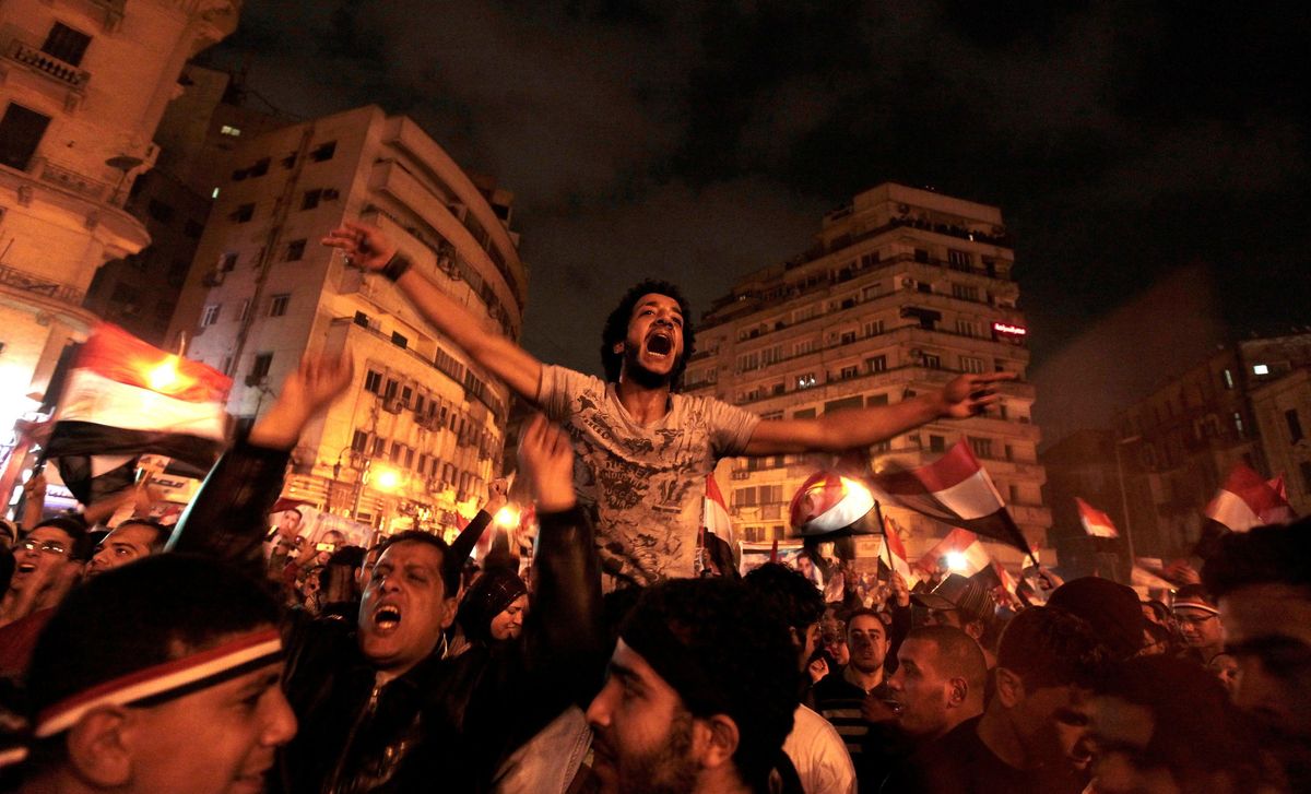  Anti-government protesters celebrate inside Tahrir Square after the announcement of Egyptian President Hosni Mubarak's resignation in Cairo, Egypt, February 11, 2011.