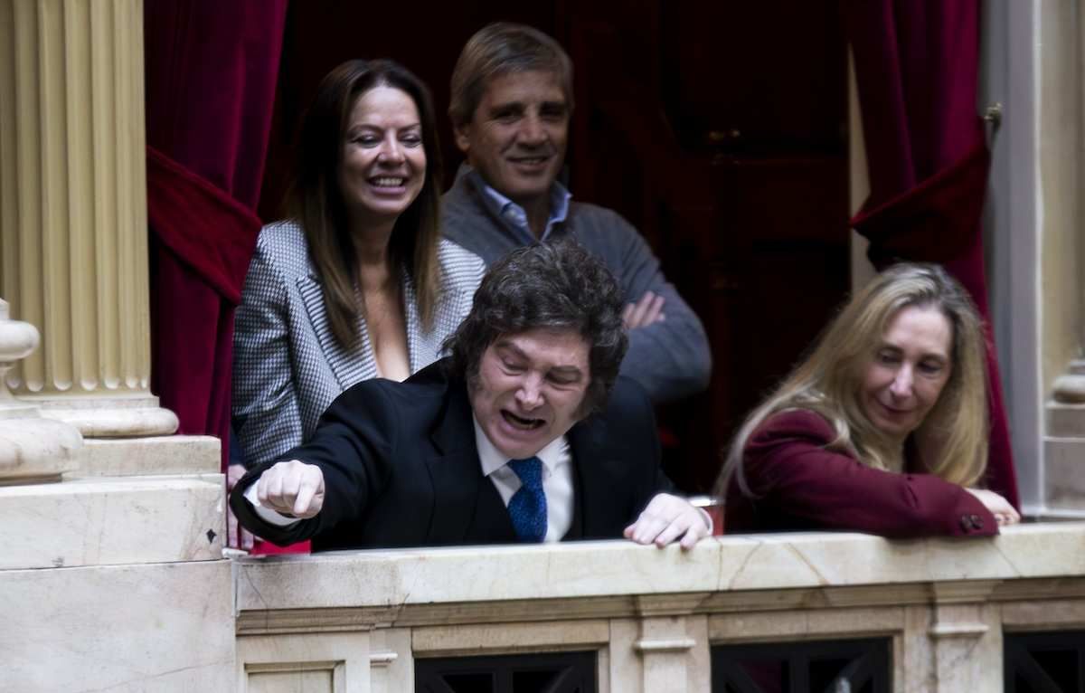 Argentina's President Javier Milei gestures in response to comments from deputies with Secretary of the Presidency Karina Milei, Minister of Human Capital Sandra Petovello, and Minister of Economy Luis Caputo.