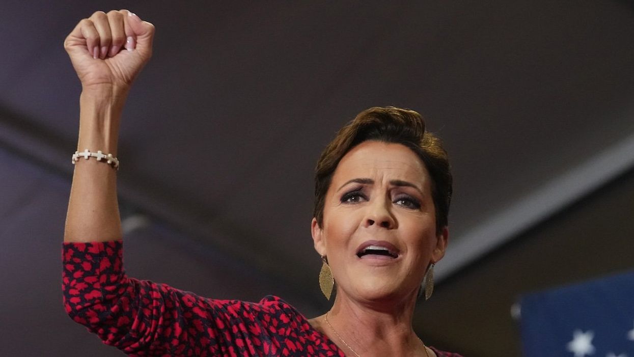 Arizona Republican Senate nominee Kari Lake gestures to the crowd gathered for vice presidential nominee JD Vance at Arizona Christian University on July 31, 2024.