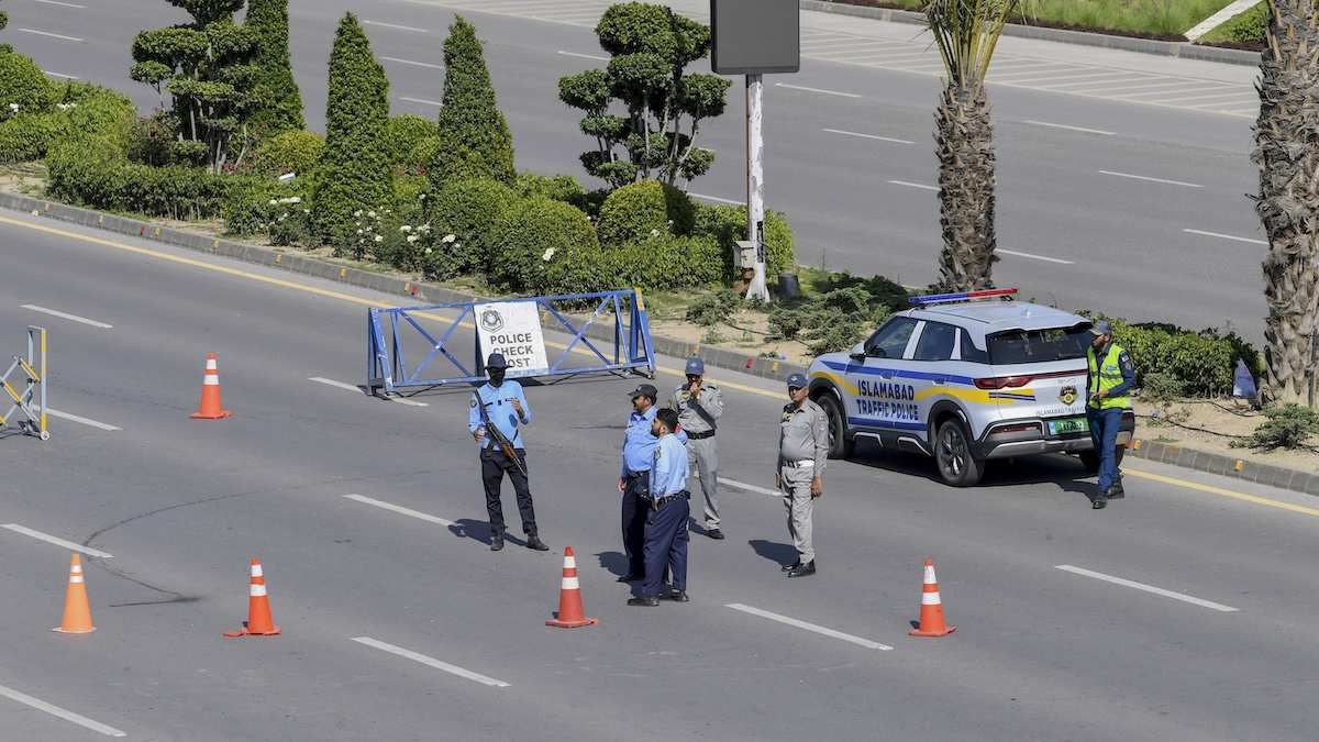Armed security personnel stand guard near the Serena Hotel in Islamabad, Pakistan, on April 19, 2026.