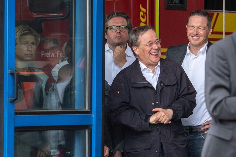 Armin Laschet laughs after the floods in North Rhine-Westphalia.