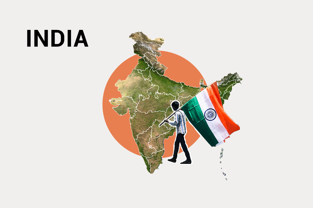 Art of man carrying the Indian flag in front of a map of India