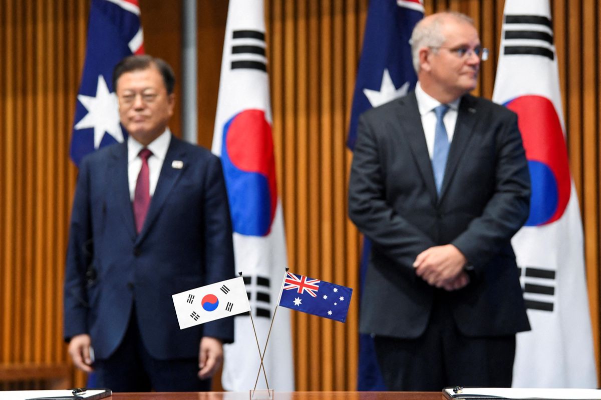 Australian and South Korean flags are pictured as Australian Prime Minister Scott Morrison and South Korean President Moon Jae-in witness a signing ceremony at Parliament House, in Canberra, Australia December 13, 2021.