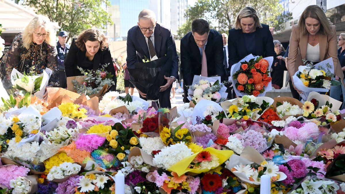 Australian Prime Minister Anthony Albanese and New South Wales Premier Chris Minns join other politicians as they lay flowers at the scene of Saturday's mass stabbing at Bondi Junction, Sydney, Australia April 14, 2024. 