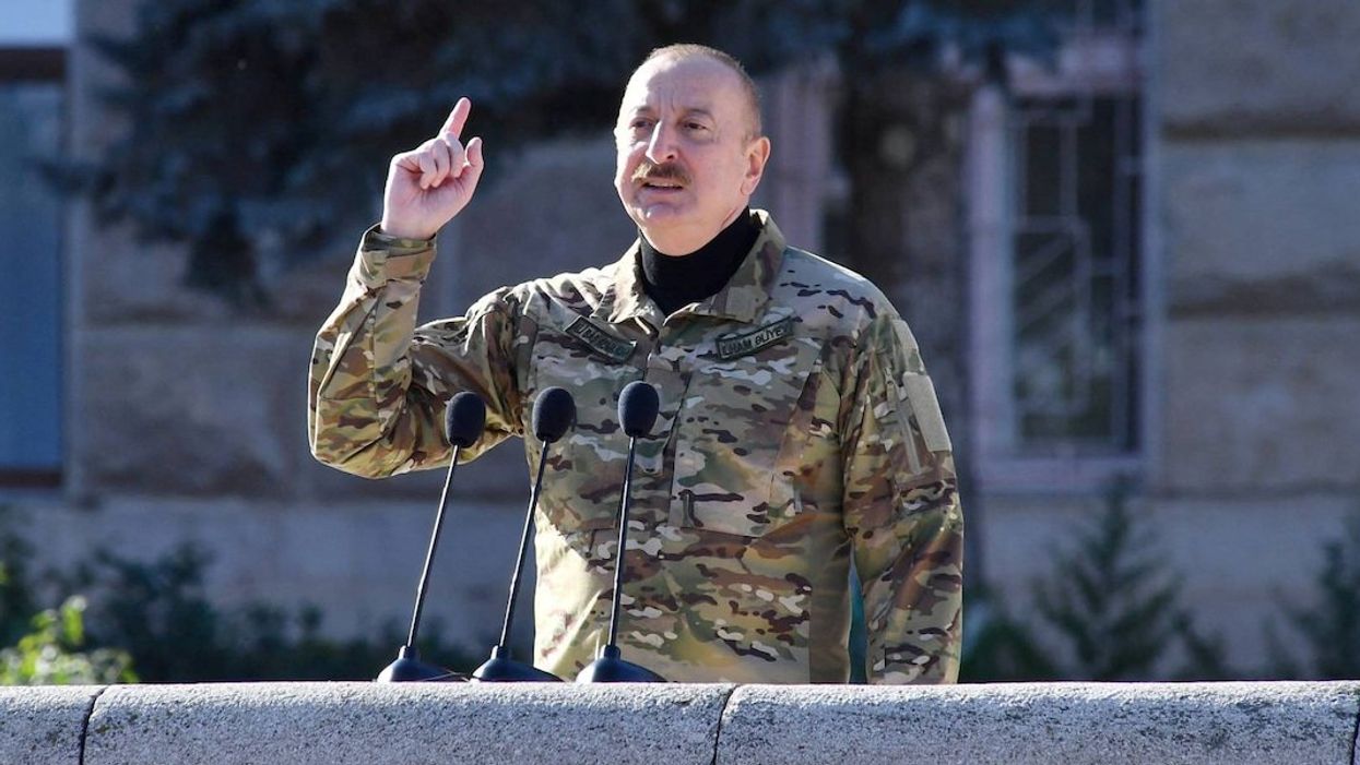 Azerbaijan's President Ilham Aliyev speaks during a military parade of his armed forces in Nagorno-Karabakh region's capital city on November 8, 2023.