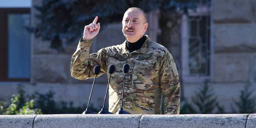 Azerbaijan's President Ilham Aliyev speaks during a military parade of his armed forces in Nagorno-Karabakh region's capital city on November 8, 2023.