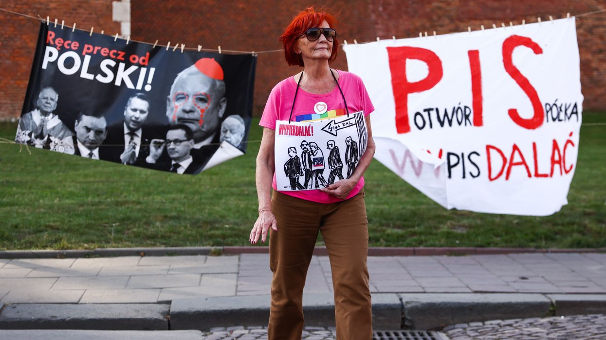 Banners ares seen during an anti-government protest in Krakow, Poland