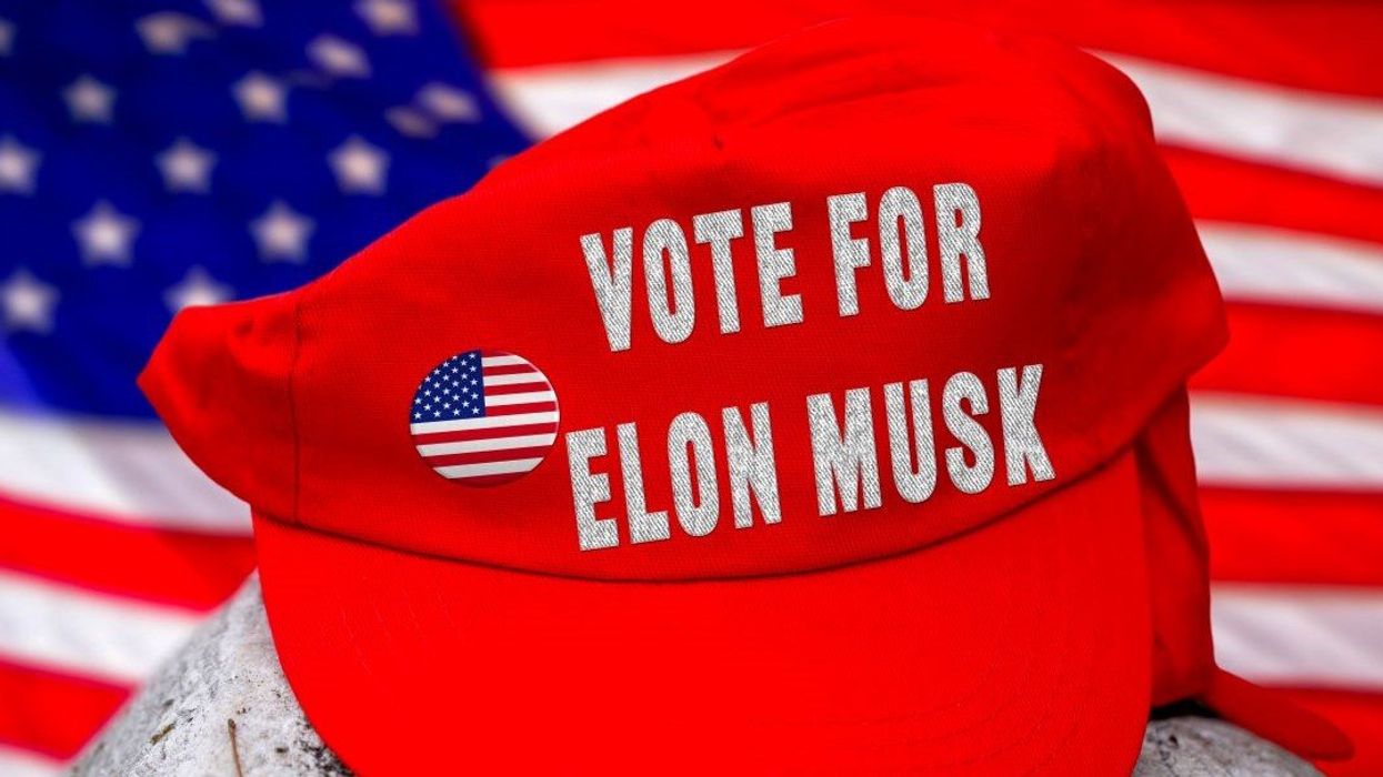 Bavaria, Germany - June 6, 2025: PHOTOMONTAGE, Red cap with VOTE FOR ELON MUSK in front of US flag.