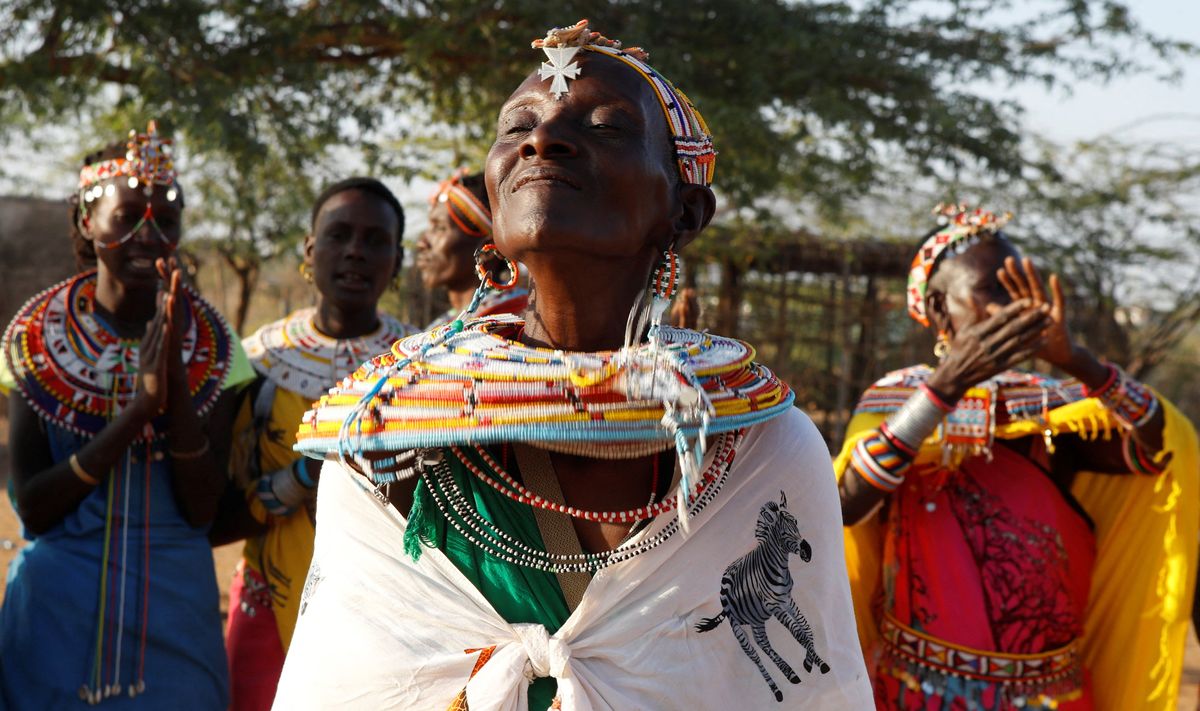 Beina Lesanjir, a woman who escaped gender based violence, participates in a traditional dance at the Umoja village, Kenya.