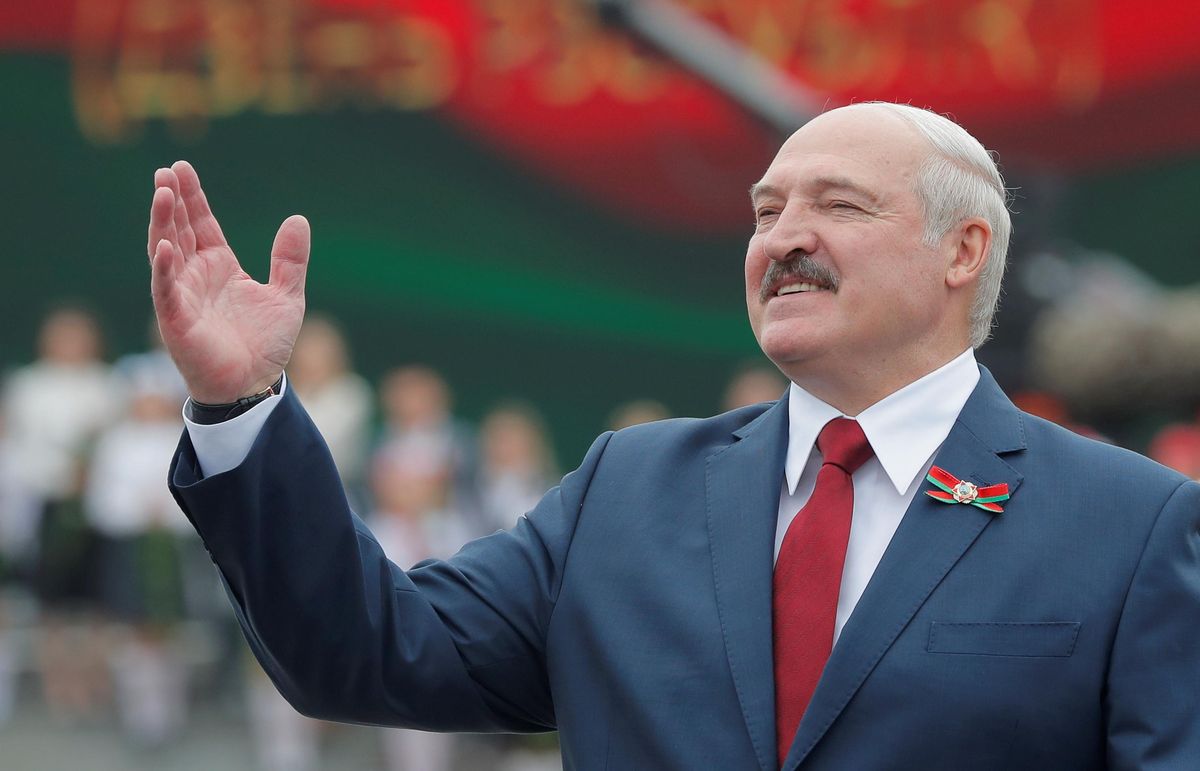 Belarusian President Alexander Lukashenko gestures while celebrating Independence Day in Minsk.