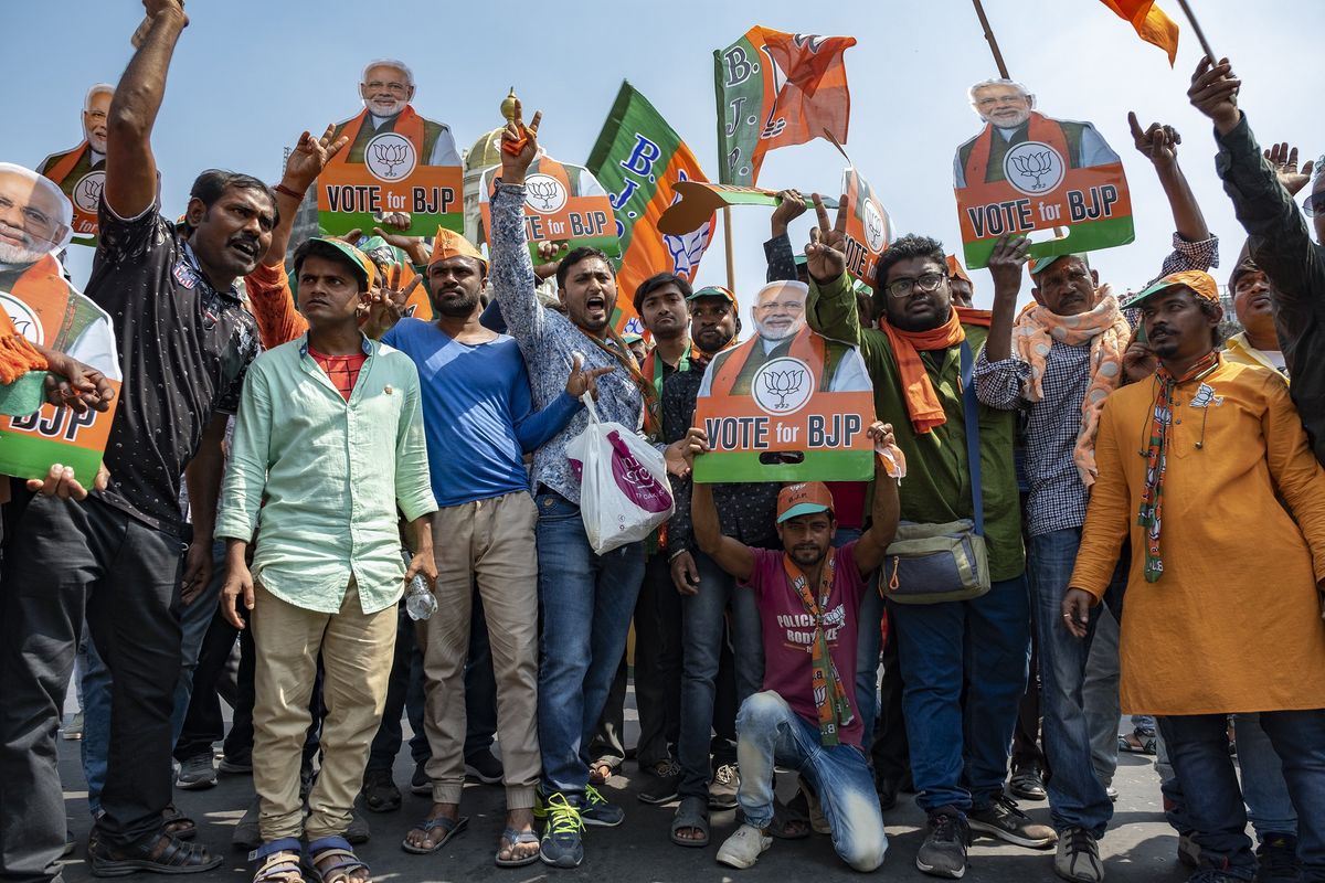 Bharatiya Janata Party (BJP) supporters chant slogans during a mass rally.