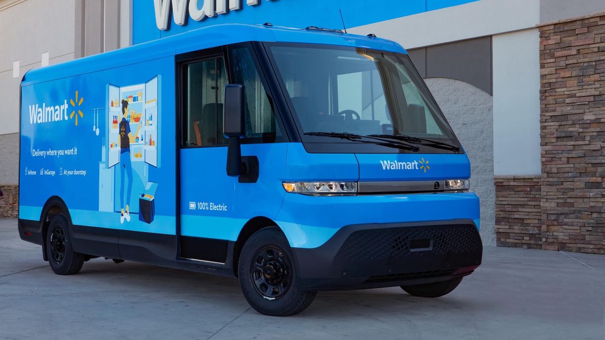 Blue Walmart delivery truck parked near a Walmart store