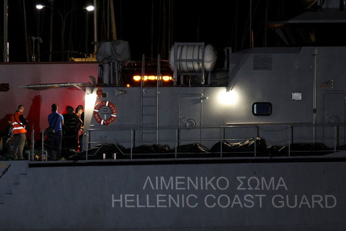 Body bags carrying migrants who died after their boat capsized in the open sea off Greece