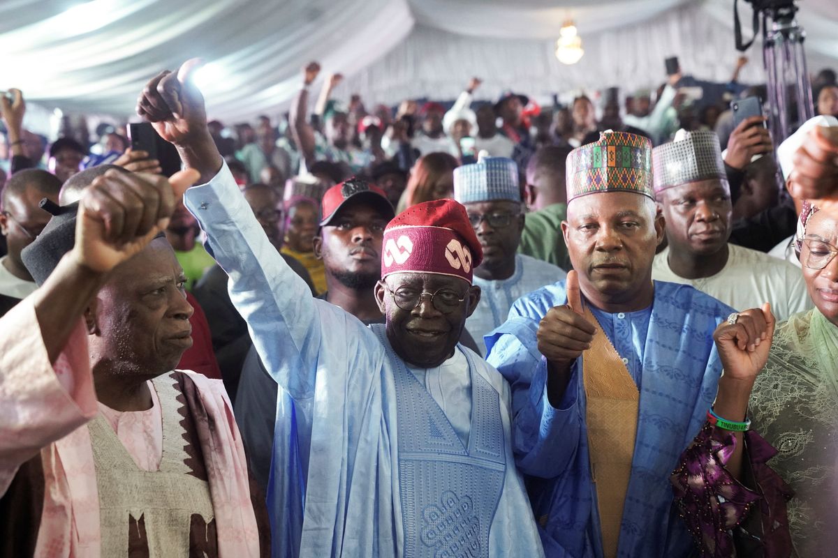 Bola Tinubu reacts after he was declared the winner in Nigeria's presidential election at his party's campaign headquarters, in Abuja.