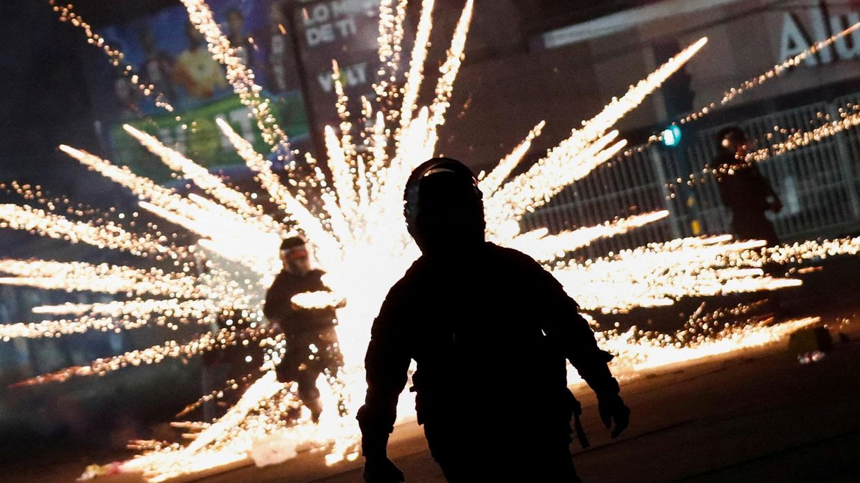 Bolivian riot police officers clash with demonstrators as protests following the arrest of Santa Cruz governor and right-wing opposition leader Luis Fernando Camacho.