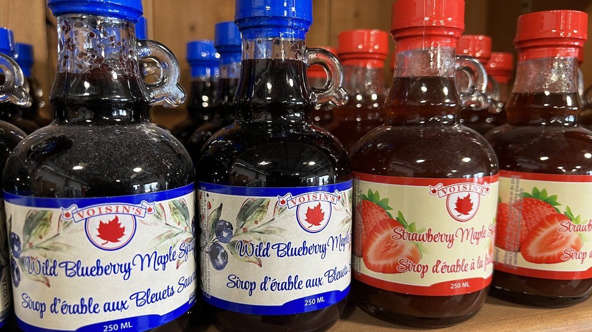 Bottles of blueberry and strawberry maple syrup displayed at a maple syrup farm in Mount Albert, Ontario, Canada, on March 05, 2022.