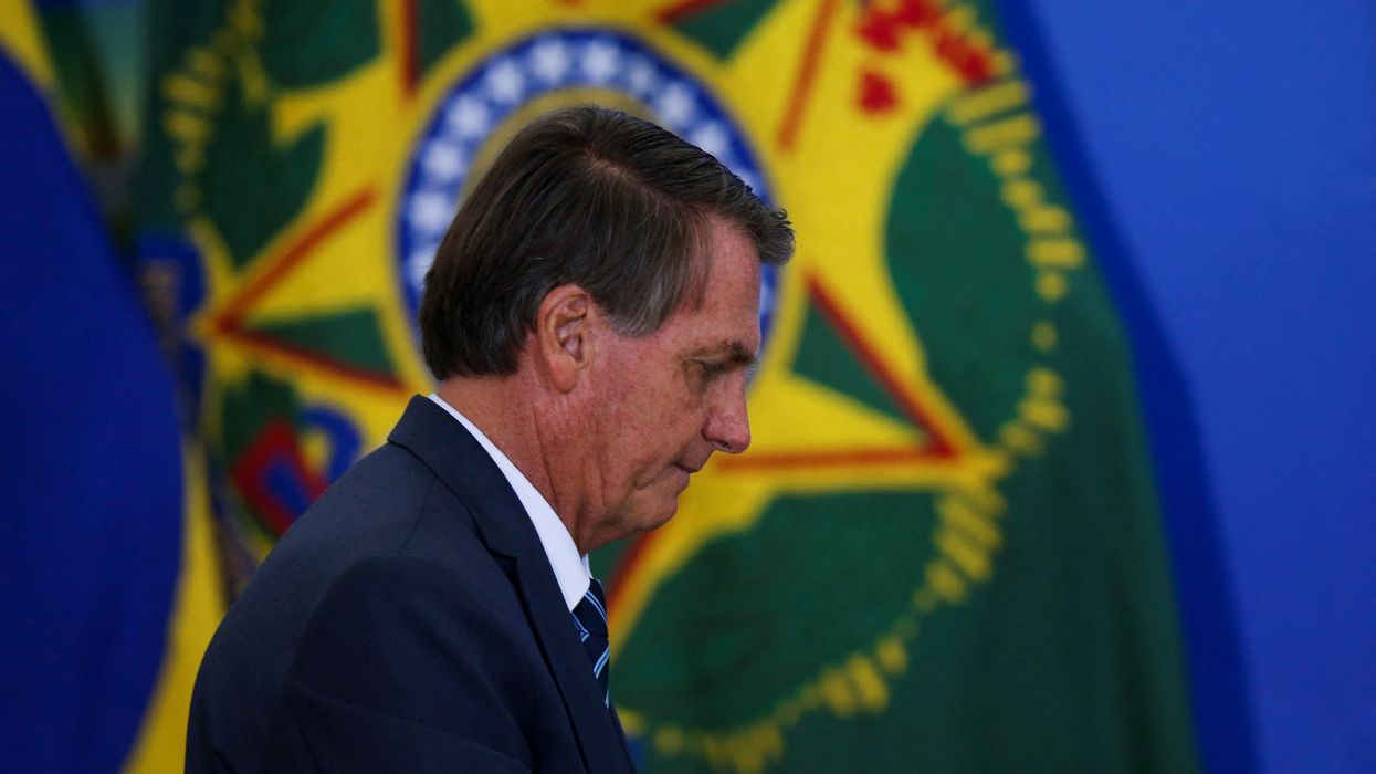 Brazil's President Jair Bolsonaro walks during a ceremony at the Planalto Palace in Brasilia, Brazil February 2, 2022.