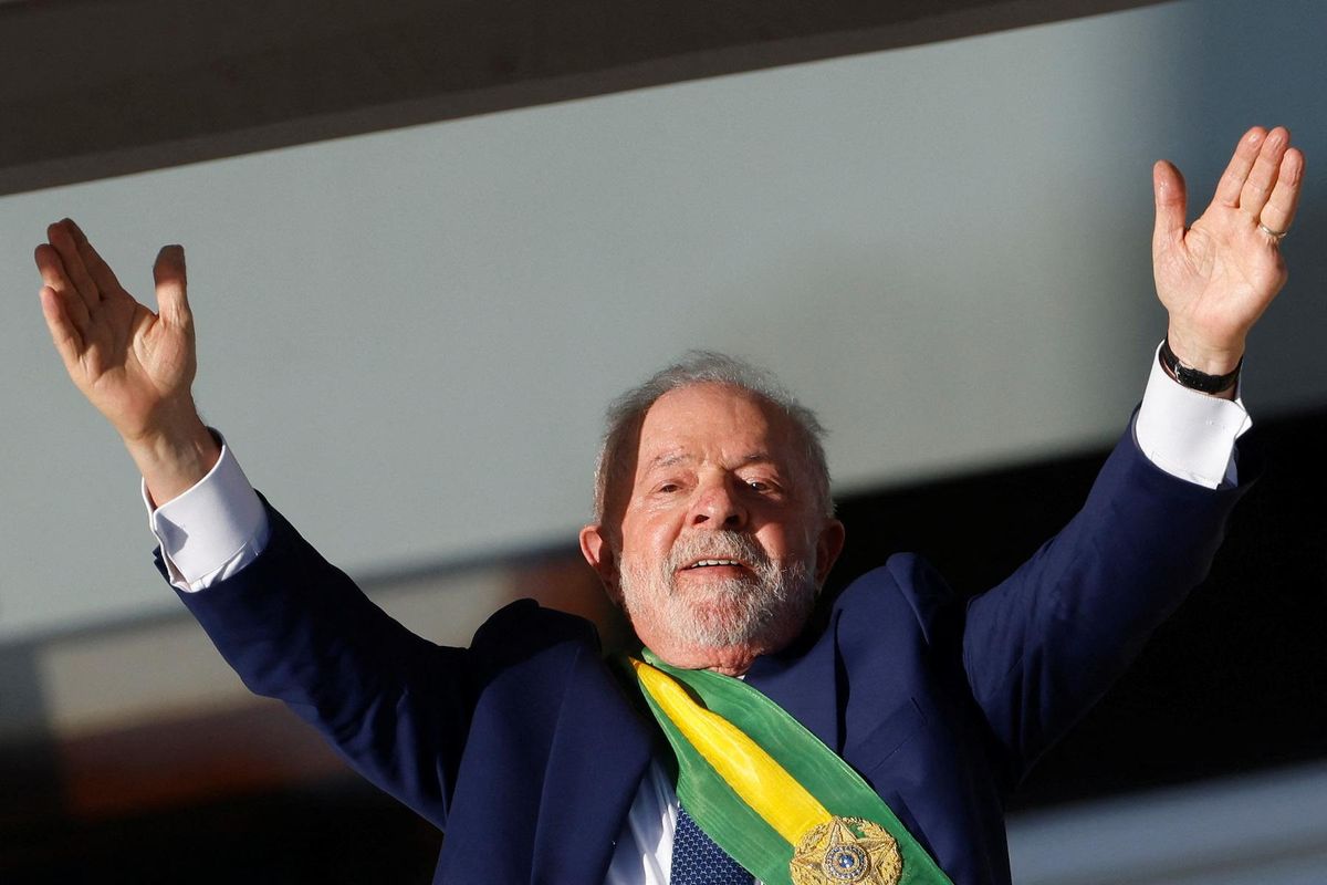 ​Brazil's President Luiz Inácio Lula da Silva greets supporters at the Planalto Palace in Brasilia.