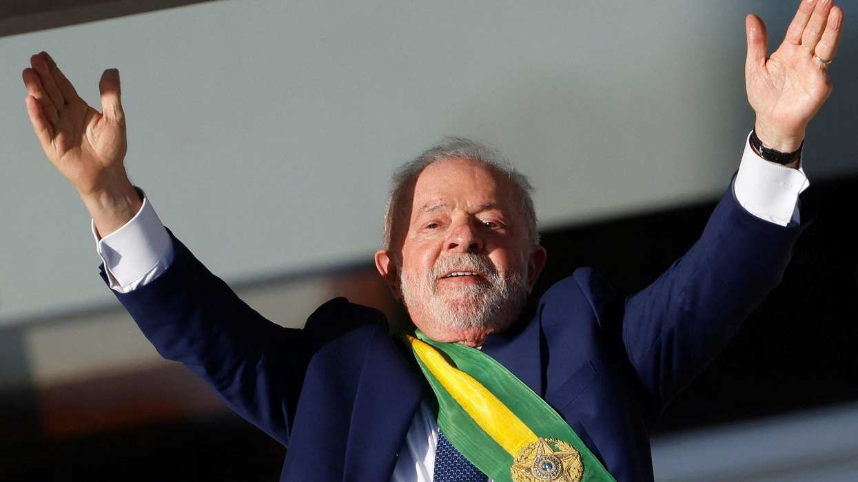 Brazil's President Luiz Inácio Lula da Silva greets supporters at the Planalto Palace in Brasilia.