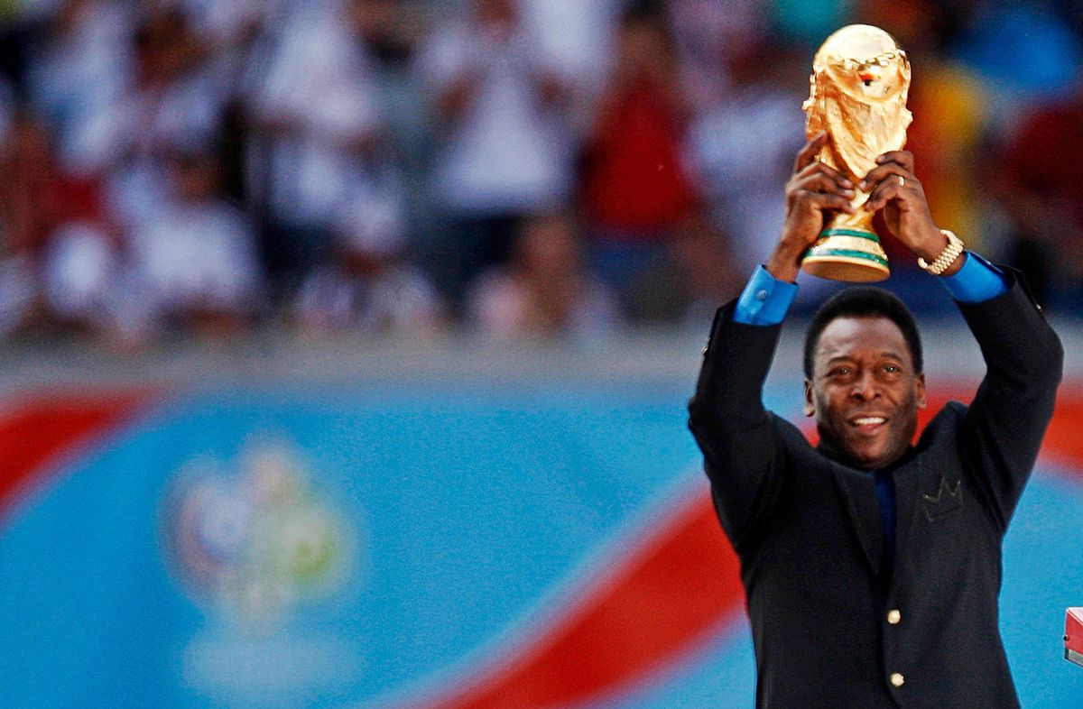 Brazilian soccer legend Pele holds the World Cup trophy during the World Cup 2006 opening ceremony in Munich, Germany.