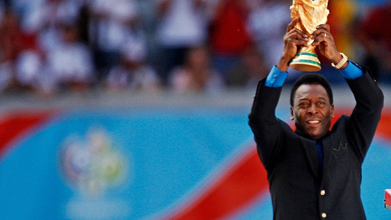 Brazilian soccer legend Pele holds the World Cup trophy during the World Cup 2006 opening ceremony in Munich, Germany.