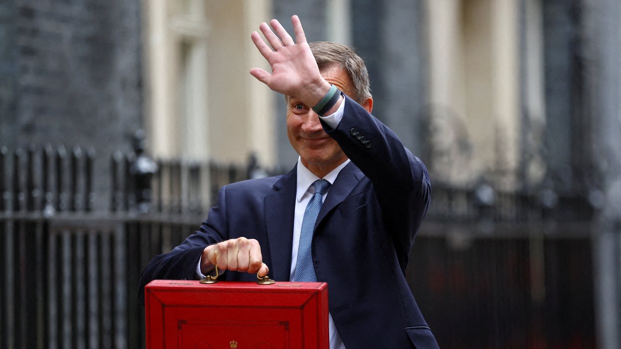 Britain's Chancellor of the Exchequer Jeremy Hunt poses with the budget box at Downing Street in London, Britain March 15, 2023.