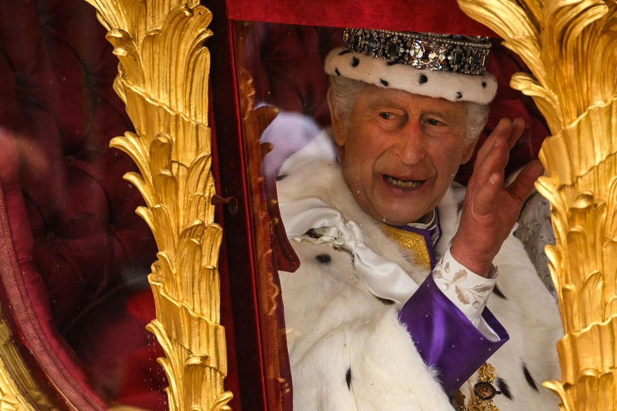 Britain's King Charles III waves.