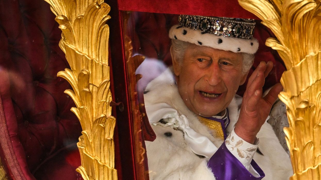 Britain's King Charles III waves.