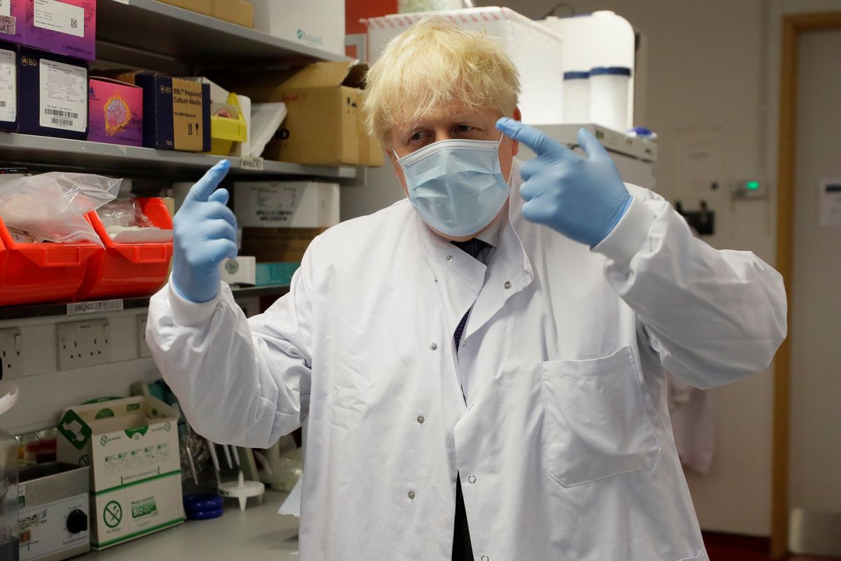 : Britain's Prime Minister Boris Johnson gestures during a visit to the Jenner Institute in Oxford, Britain, September 18, 2020