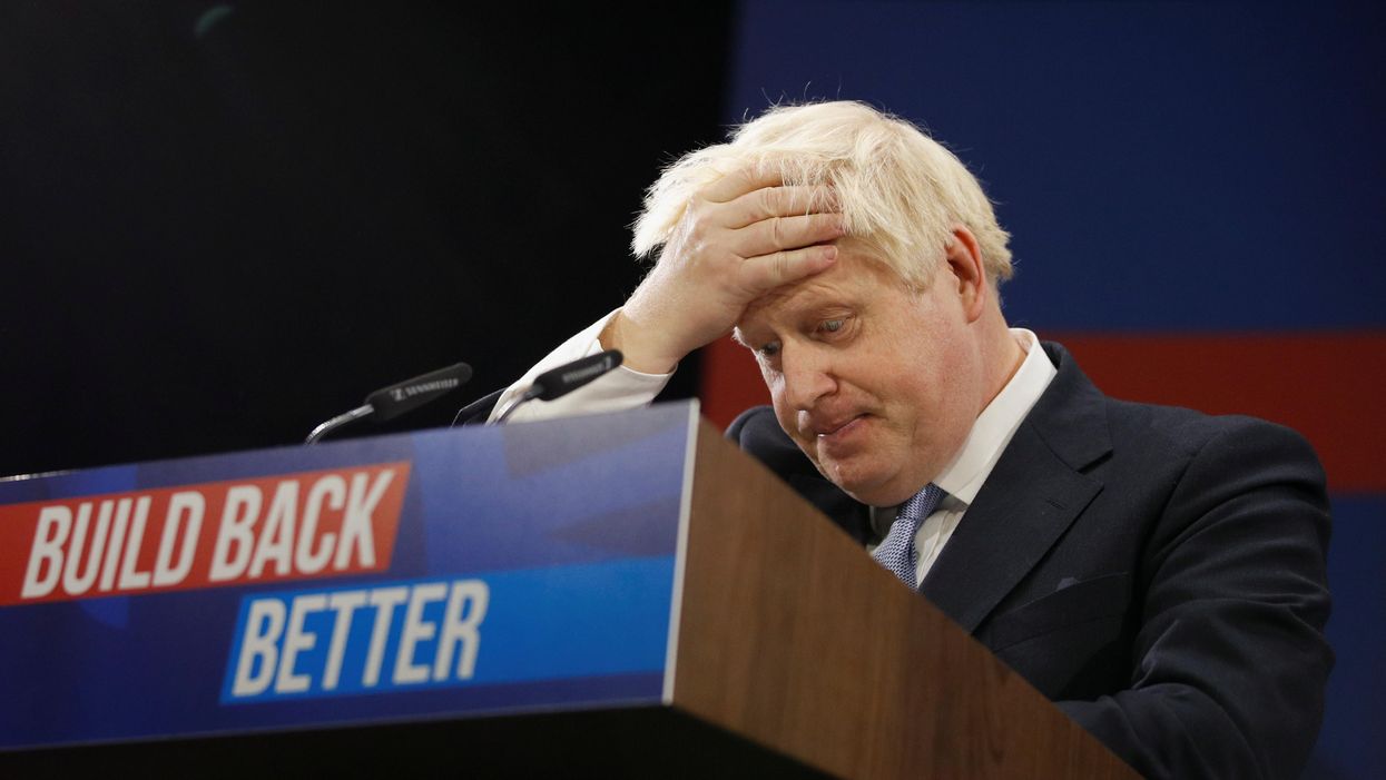 Britain's Prime Minister Boris Johnson reacts as he delivers a speech during the annual Conservative Party Conference, in Manchester, Britain, October 6, 2021.