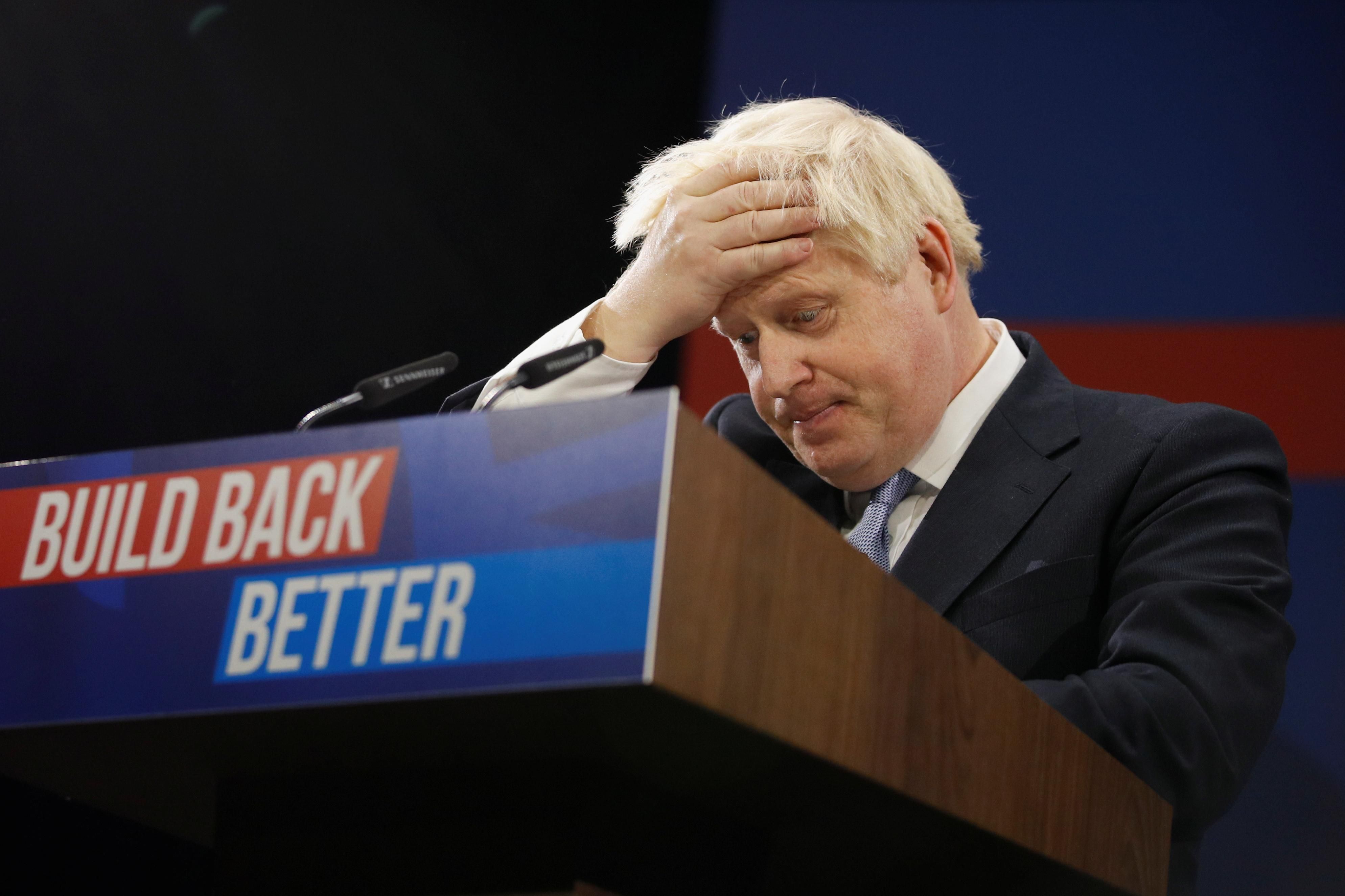 Britain's Prime Minister Boris Johnson reacts as he delivers a speech during the annual Conservative Party Conference, in Manchester, Britain, October 6, 2021.