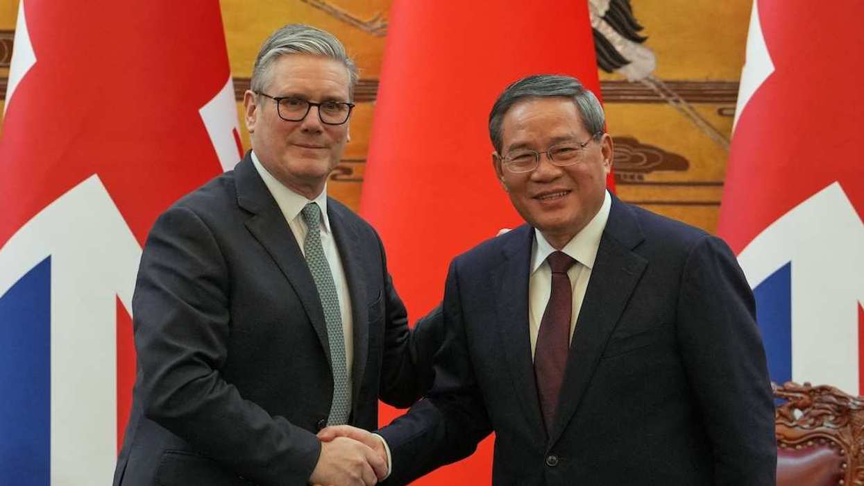 Britain's Prime Minister Keir Starmer and Chinese Premier Li Qiang shake hands after a signing ceremony held at the Great Hall of the People in Beijing, China, Thursday, Jan. 29, 2026.