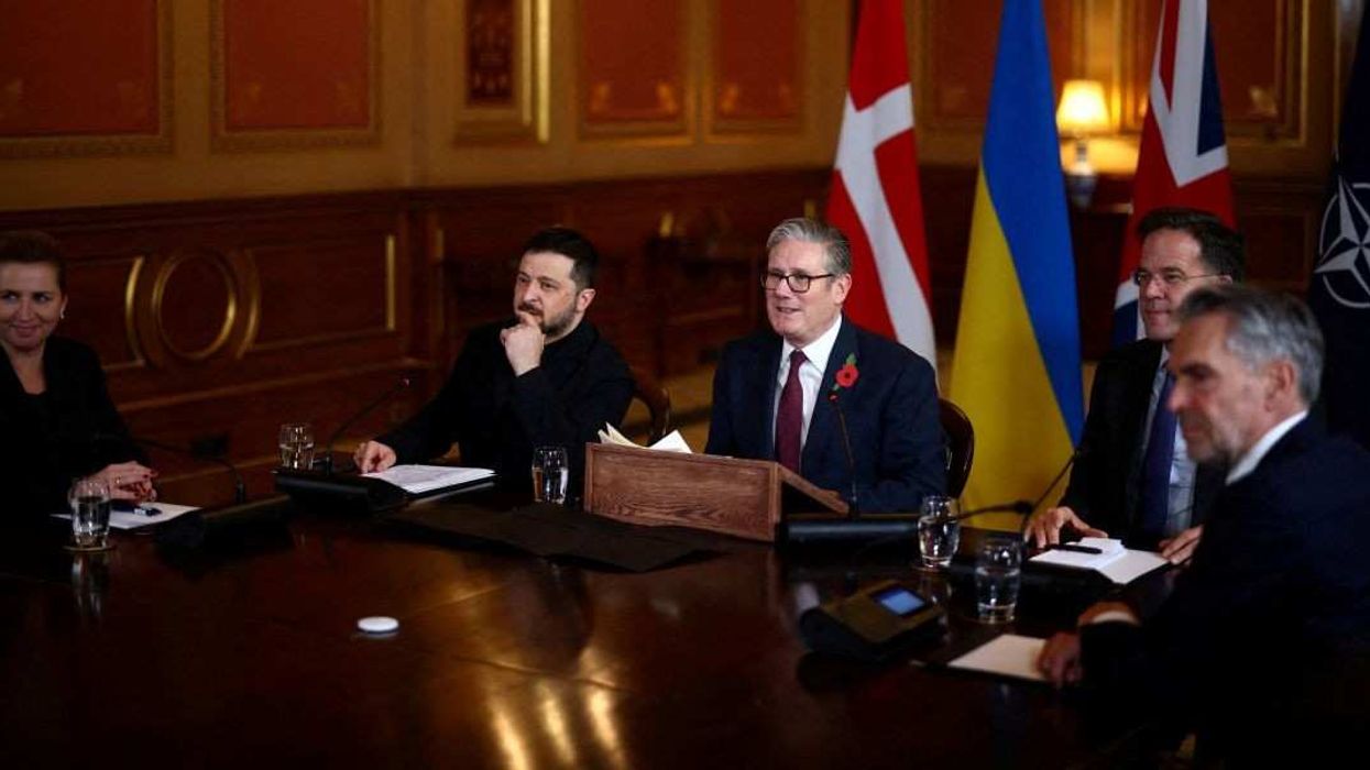 Britain's Prime Minister Keir Starmer is flanked by Ukraine's President Volodymyr Zelenskiy and NATO Secretary-General Mark Rutte, Denmark's Prime Minister Mette Frederiksen and Dutch Prime Minister Dick Schoof as he hosts a 'Coalition of the Willing' meeting of international partners on Ukraine at the Foreign, Commonwealth, and Development Office (FCDO) in London, Britain, October 24, 2025.