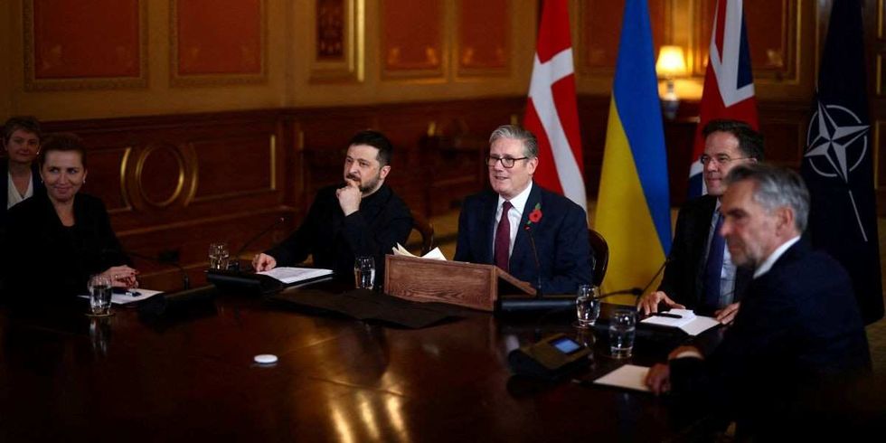 Britain's Prime Minister Keir Starmer is flanked by Ukraine's President Volodymyr Zelenskiy and NATO Secretary-General Mark Rutte, Denmark's Prime Minister Mette Frederiksen and Dutch Prime Minister Dick Schoof as he hosts a 'Coalition of the Willing' meeting of international partners on Ukraine at the Foreign, Commonwealth, and Development Office (FCDO) in London, Britain, October 24, 2025.