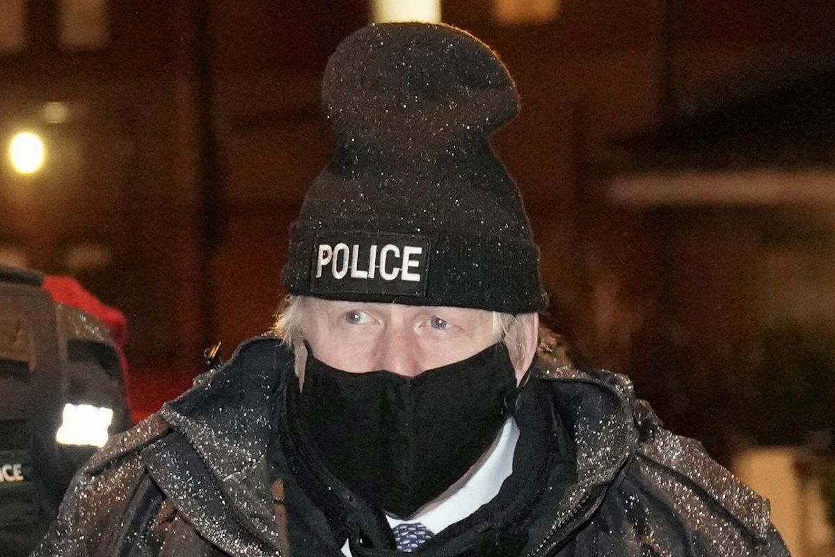 British Prime Minister Boris Johnson observes an early morning Merseyside police raid on a home in Liverpool as part of 'Operation Toxic' to infiltrate County Lines drug dealings in Liverpool, Britain December 6, 2021.