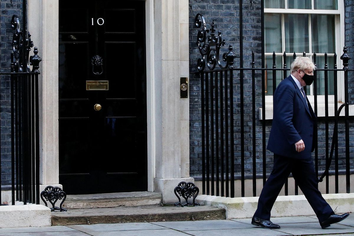 British Prime Minister Boris Johnson walks outside Downing Street in London, Britain, January 12, 2022. 